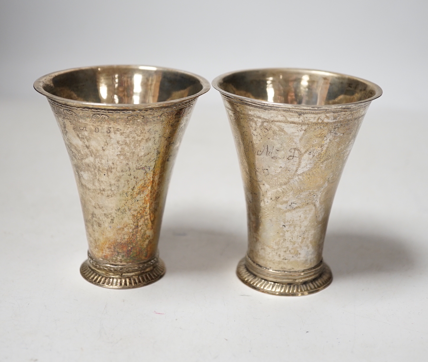 Two 19th century Swedish white metal beakers, of tapering form, one with maker's mark Seseman, 96mm.